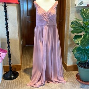 Floor length blush pink bridesmaid dress.
